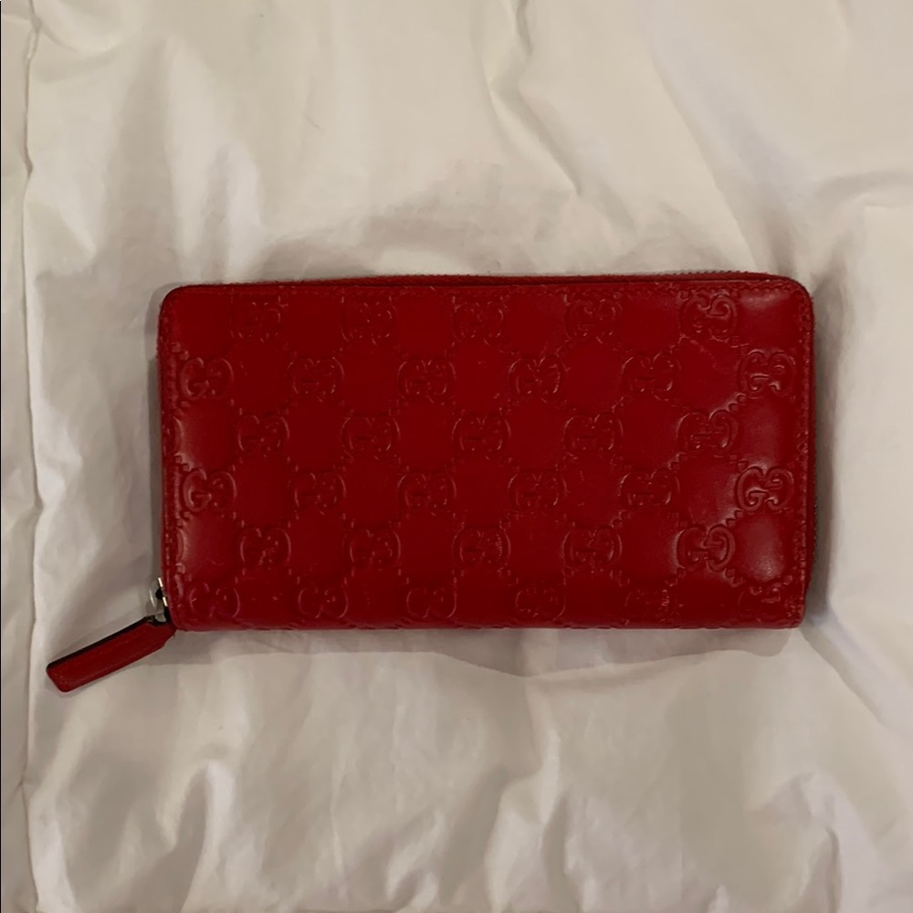 Gucci Authentic Red Embossed Leather Wallet w/serial numbers.